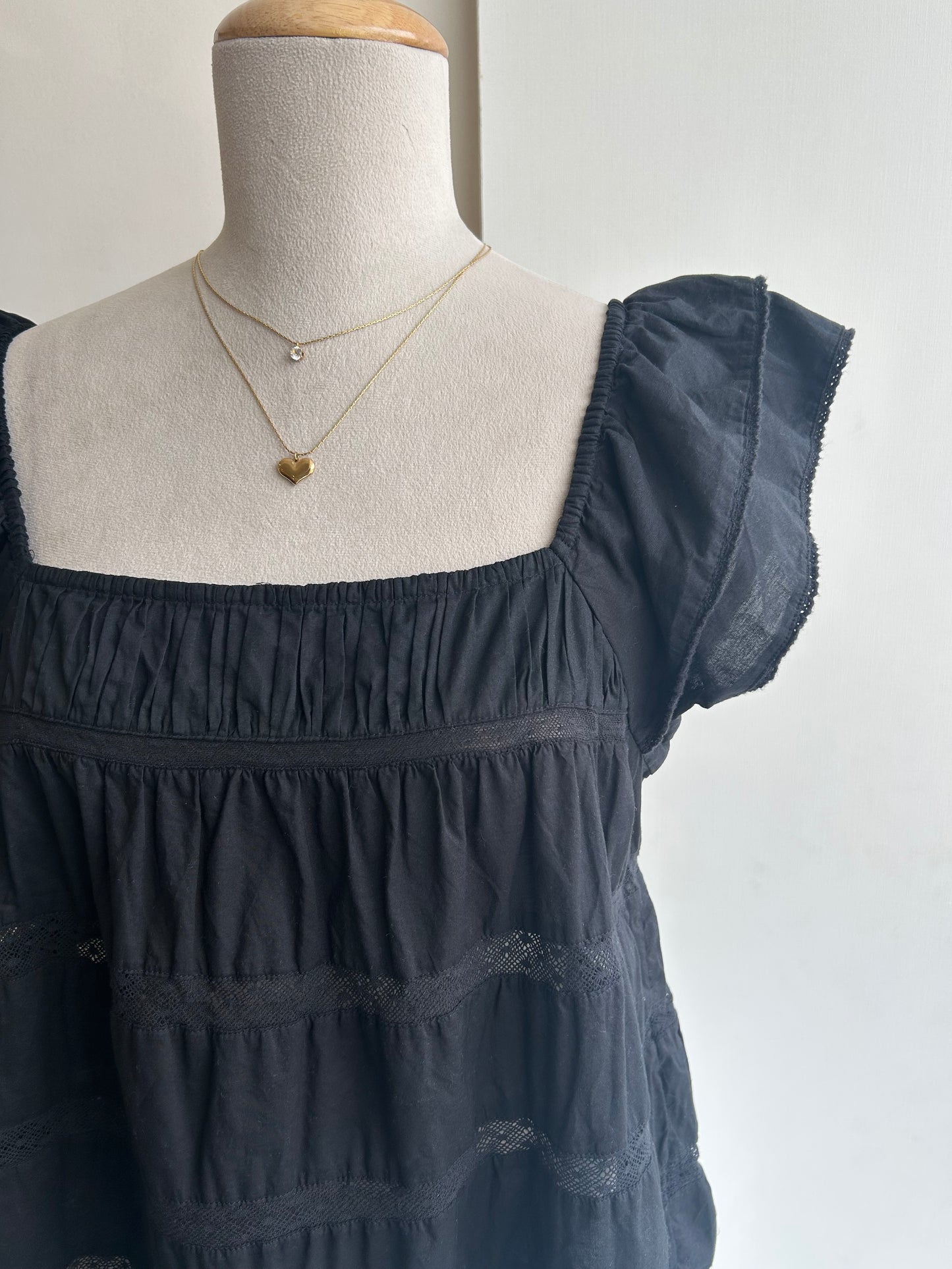 Black ruffled sleeve top